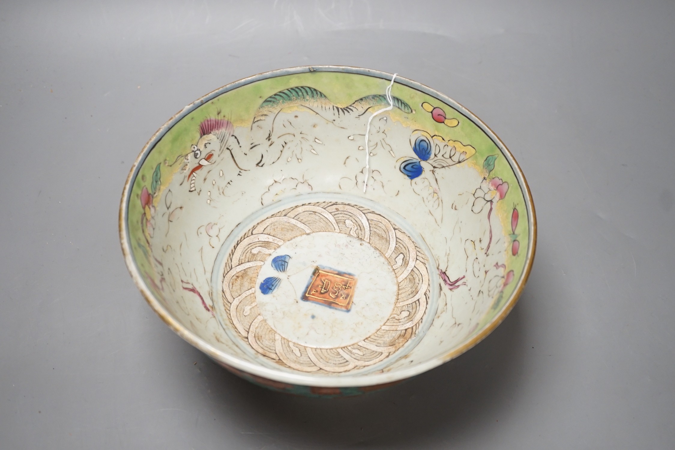 An 18th century clobbered Chinese or Japanese porcelain bowl, 24.5cm diameter